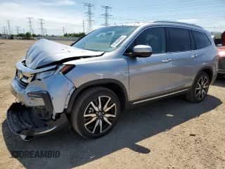 2022 Honda Pilot Touring 7-Passenger z VIN 5FNYF6H68NB052014, wystawiony jako Copart lot #61864805 z przebiegiem 39 124 mil mil oraz Szkoda całkowita • Salvage title. Historia ofert i sprzedaży dostępna na DreamBid. Obrazek 1.