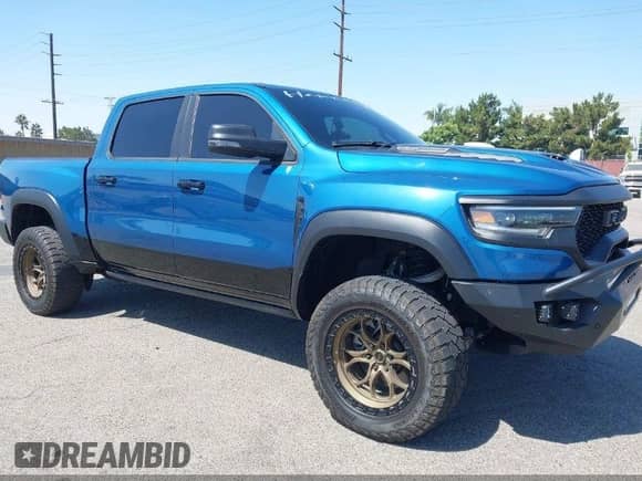 2024 Ram 1500 TRX с VIN 1C6SRFU95RN230215, выставлен на аукционе IAAI как лот 43197408 с пробегом 8 034 миль миль и . История ставок и продаж доступна на DreamBid. Изображение 1.