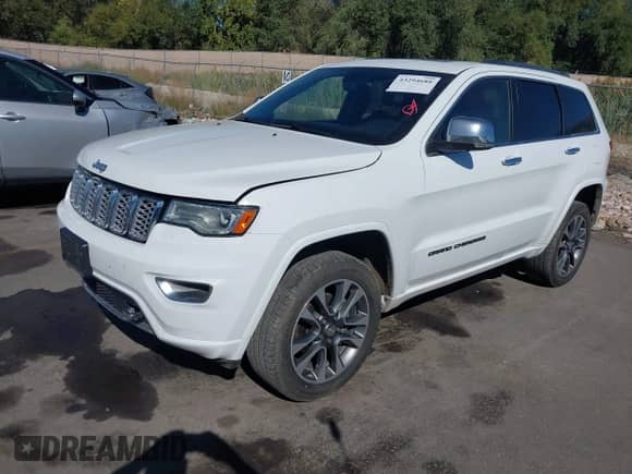 2018 Jeep Grand Cherokee Overland with VIN 1C4RJFCG7JC324708, listed as a IAAI auction lot 43294688 with 131,457 mi miles and . Bid and sale history available at DreamBid. Image 2.