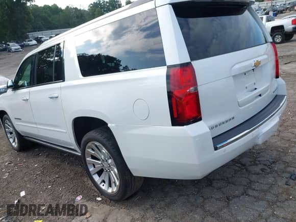2019 Chevrolet Suburban Premier with VIN 1GNSCJKC9KR126778, listed as a IAAI auction lot 42675554 with 164,489 mi miles and . Bid and sale history available at DreamBid. Image 3.