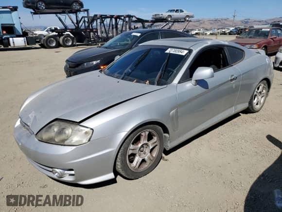 2003 Hyundai Tiburon GT с VIN KMHHN65F83U024950, выставлен на аукционе Copart как лот 70780994 с пробегом 178 681 миль миль и Списание • Salvage title. История ставок и продаж доступна на DreamBid. Изображение 1.