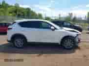 2022 Mazda CX-5 S Select z VIN JM3KFBBM5N0598278, wystawiony jako IAAI lot #42967602 z przebiegiem 26 412 mil mil oraz . Historia ofert i sprzedaży dostępna na DreamBid. Obrazek 13.