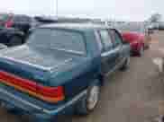 1993 Dodge Spirit with VIN 1B3XA46K5PF605264, listed as a IAAI auction lot 41561970 with 94,670 mi miles and . Bid and sale history available at DreamBid. Image 6.