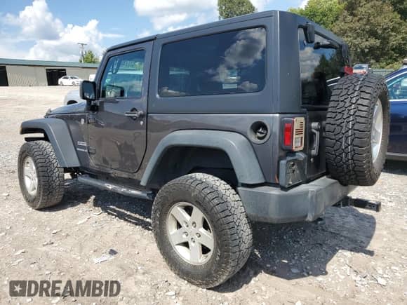 2016 Jeep Wrangler Sport with VIN 1C4AJWAG6GL194879, listed as a Copart auction lot 71034895 with 103,769 mi miles and Salvage title. Bid and sale history available at DreamBid. Image 2.