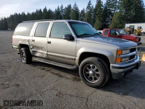 1999 Chevrolet Suburban z VIN 1GNGK26J9XJ518169, wystawiony jako Copart lot #89381325 z przebiegiem 53 435 mil mil oraz Szkoda całkowita • Salvage title. Historia ofert i sprzedaży dostępna na DreamBid. Obrazek 4.