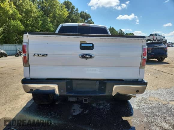 2013 Ford F-150 Lariat with VIN 1FTFW1ET9DKG40123, listed as a Copart auction lot 85496405 with 212,562 mi miles and Salvage title. Bid and sale history available at DreamBid. Image 6.