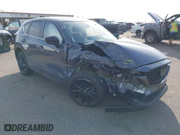 2025 Mazda CX-5 S Carbon Edition z VIN JM3KFBCM3S0689995, wystawiony jako IAAI lot #42922834 z przebiegiem 2 087 mil mil oraz . Historia ofert i sprzedaży dostępna na DreamBid. Obrazek 1.