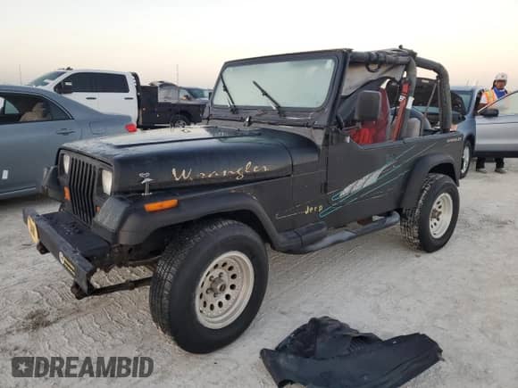 1992 Jeep Wrangler with VIN 2J4FY29SXNJ554171, listed as a Copart auction lot 77655294 with 115,494 mi miles and Salvage title. Bid and sale history available at DreamBid. Image 1.