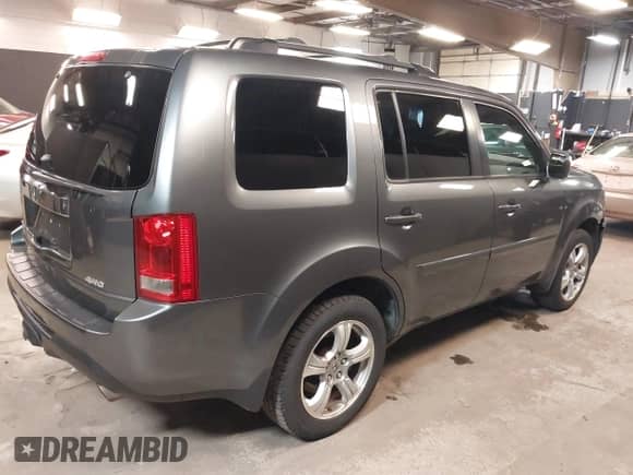 2013 Honda Pilot EX-L with VIN 5FNYF4H74DB055262, listed as a IAAI auction lot 42515947 with 229,037 mi miles and . Bid and sale history available at DreamBid. Image 4.