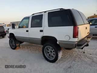 1999 Chevrolet Tahoe с VIN 1GNEC13R2XJ556769, выставлен на аукционе Copart как лот 77561624 с пробегом 205 238 миль миль и На запчасти • Non repairable. История ставок и продаж доступна на DreamBid. Изображение 2.