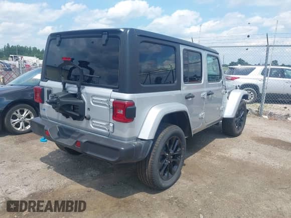 2023 Jeep Wrangler Sahara with VIN 1C4JJXP69PW695915, listed as a IAAI auction lot 42662028 with 36,957 mi miles and . Bid and sale history available at DreamBid. Image 4.