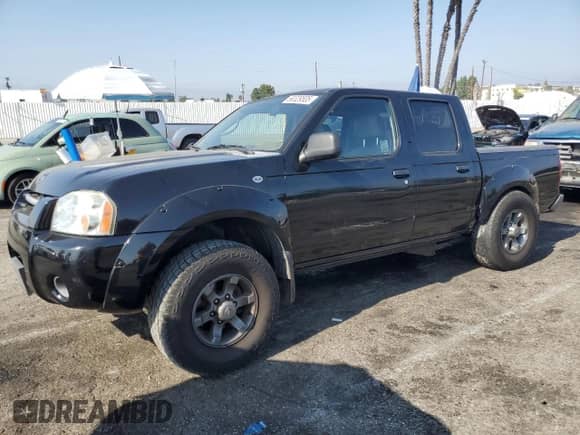 2004 Nissan Frontier XE with VIN 1N6ED27T64C477426, listed as a Copart auction lot 68329535 with 132,259 mi miles and Salvage title. Bid and sale history available at DreamBid. Image 1.