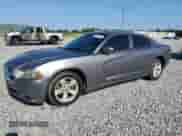 2011 Dodge Charger SE with VIN 2B3CL3CG3BH586613, listed as a Copart auction lot 69274625 with 243,875 mi miles and Salvage title. Bid and sale history available at DreamBid. Image 1.