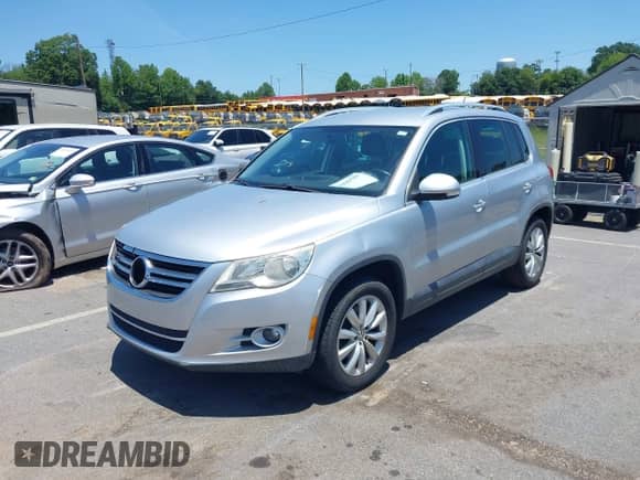 2011 Volkswagen Tiguan S with VIN WVGAV7AXXBW511253, listed as a IAAI auction lot 42569188 with 154,229 mi miles and . Bid and sale history available at DreamBid. Image 2.