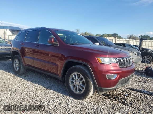 2018 Jeep Grand Cherokee Laredo E with VIN 1C4RJEAG1JC131077, listed as a Copart auction lot 82291615 with 100,413 mi miles and Clean title. Bid and sale history available at DreamBid. Image 4.