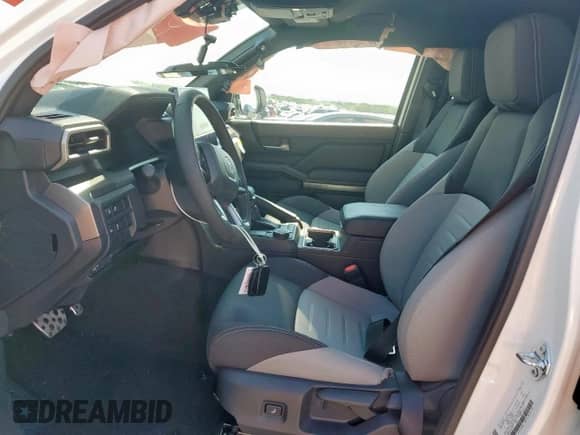 2025 Toyota Tacoma SR5 with VIN 3TMKB5FNXSM036779, listed as a Copart auction lot 68123025 with 557 mi miles and Salvage title. Bid and sale history available at DreamBid. Image 7.