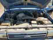 1990 Ford F-150 z VIN 1FTEF14N1LPA30295, wystawiony jako Copart lot #69413825 z przebiegiem 283 557 mil mil oraz Czysty tytuł • Clean title. Historia ofert i sprzedaży dostępna na DreamBid. Obrazek 11.