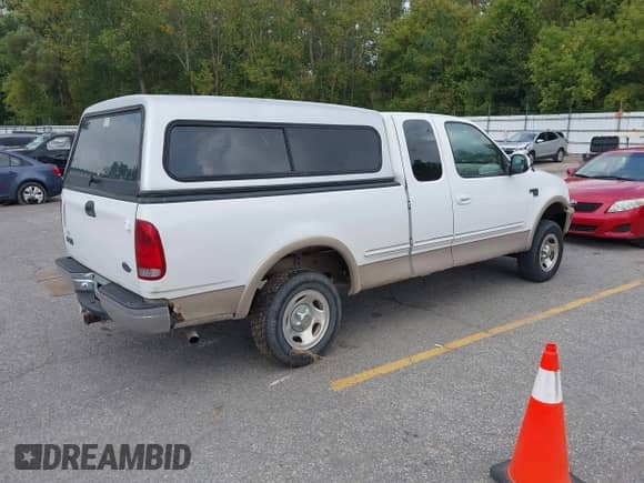 1998 Ford F-150 with VIN 1FTRX18L0WKC22686, listed as a IAAI auction lot 43270211 with 128,823 mi miles and . Bid and sale history available at DreamBid. Image 4.