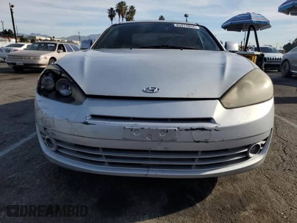 2008 Hyundai Tiburon GS с VIN KMHHM66DX8U291384, выставлен на аукционе Copart как лот 85974854 с пробегом 106 391 миль миль и Списание • Salvage title. История ставок и продаж доступна на DreamBid. Изображение 5.