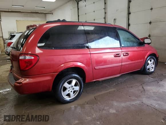 2005 Dodge Caravan SXT с VIN 2D4GP44L45R415974, выставлен на аукционе Copart как лот 69434184 с пробегом 106 997 миль миль и Списание • Salvage title. История ставок и продаж доступна на DreamBid. Изображение 3.