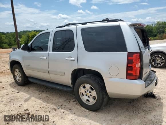 2013 Chevrolet Tahoe LT with VIN 1GNSKBE00DR213384, listed as a Copart auction lot 67000715 with 215,061 mi miles and Salvage title. Bid and sale history available at DreamBid. Image 2.