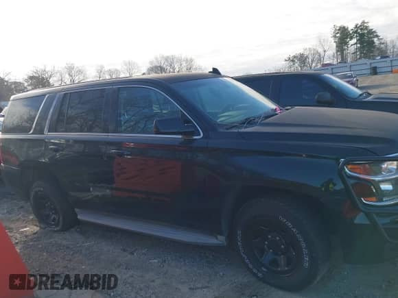 2015 Chevrolet Tahoe Commercial with VIN 1GNLC2EC4FR535329, listed as a IAAI auction lot 41643486 with 185,326 mi miles and . Bid and sale history available at DreamBid. Image 13.