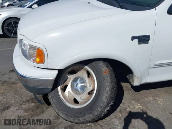 2000 Ford F-150 XL with VIN 1FTRF18W2YNB42014, listed as a IAAI auction lot 41827247 with Not provided miles and . Bid and sale history available at DreamBid. Image 6.