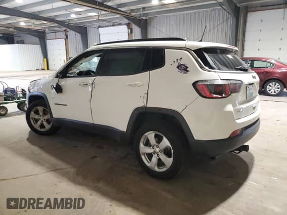 2018 Jeep Compass Latitude with VIN 3C4NJDBB9JT492251, listed as a Copart auction lot 63692595 with 82,820 mi miles and Salvage title. Bid and sale history available at DreamBid. Image 2.