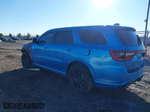 2018 Dodge Durango SRT with VIN 1C4SDJGJ1JC415720, listed as a IAAI auction lot 41193674 with 63,140 mi miles and . Bid and sale history available at DreamBid. Image 3.