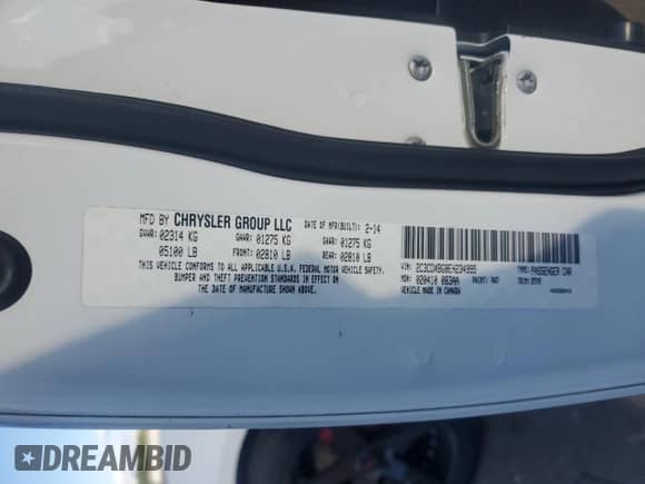 2014 Dodge Charger SE with VIN 2C3CDXBG8EH234995, listed as a Copart auction lot 81899065 with 86,505 mi miles and Salvage title. Bid and sale history available at DreamBid. Image 12.