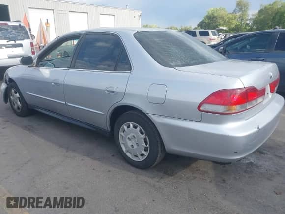 2001 Honda Accord LX with VIN 1HGCG56431A084831, listed as a IAAI auction lot 42725656 with 214,356 mi miles and . Bid and sale history available at DreamBid. Image 3.