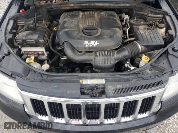 2013 Jeep Grand Cherokee Limited z VIN 1C4RJEBG0DC642363, wystawiony jako Copart lot #89741715 z przebiegiem 203 848 mil mil oraz Czysty tytuł • Clean title. Historia ofert i sprzedaży dostępna na DreamBid. Obrazek 12.