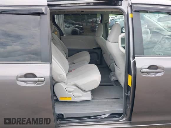 2012 Toyota Sienna with VIN 5TDKA3DC9CS013553, listed as a IAAI auction lot 42096137 with 181,993 mi miles and . Bid and sale history available at DreamBid. Image 8.