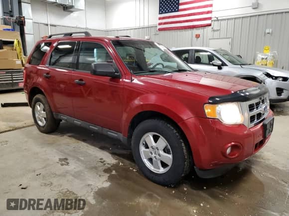 2011 Ford Escape XLT with VIN 1FMCU9D71BKC11644, listed as a Copart auction lot 55958615 with 248,084 mi miles and Salvage title. Bid and sale history available at DreamBid. Image 4.
