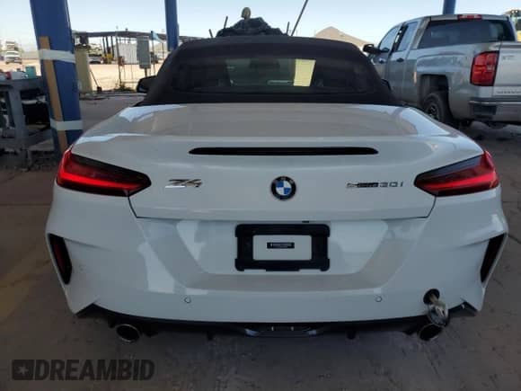 2020 BMW Z4 sDrive30i with VIN WBAHF3C0XLWW60530, listed as a Copart auction lot 57099555 with 20,464 mi miles and Salvage title. Bid and sale history available at DreamBid. Image 6.