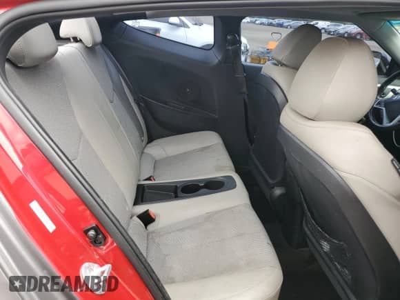 2014 Hyundai Veloster z VIN KMHTC6AD0EU196106, wystawiony jako Copart lot #69494305 z przebiegiem 102 472 mil mil oraz Szkoda całkowita • Salvage title. Historia ofert i sprzedaży dostępna na DreamBid. Obrazek 10.