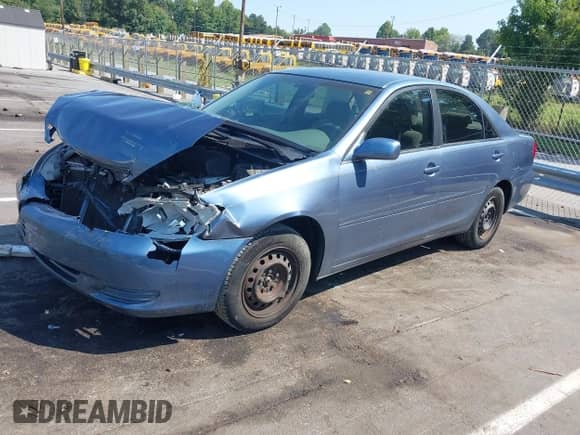 2003 Toyota Camry XLE with VIN 4T1BE32K73U660930, listed as a IAAI auction lot 43162968 with 291,748 mi miles and . Bid and sale history available at DreamBid. Image 2.