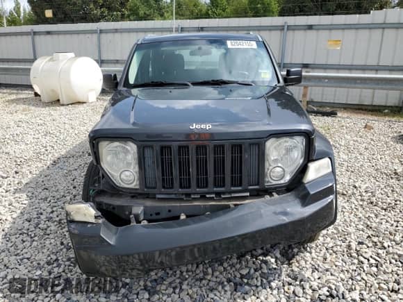 2011 Jeep Liberty Sport with VIN 1J4PN2GK7BW560109, listed as a Copart auction lot 82042155 with 145,599 mi miles and Salvage title. Bid and sale history available at DreamBid. Image 5.