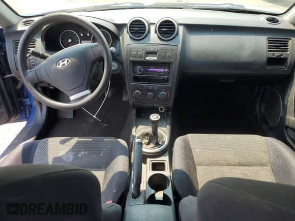 2005 Hyundai Tiburon GS с VIN KMHHM65D55U174406, выставлен на аукционе Copart как лот 64487555 с пробегом 206 900 миль миль и Списание • Salvage title. История ставок и продаж доступна на DreamBid. Изображение 8.