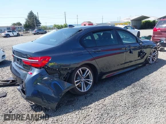 2016 BMW 7 Series 750i xDrive with VIN WBA7F2C51GG416895, listed as a IAAI auction lot 42142979 with Not provided miles and . Bid and sale history available at DreamBid. Image 4.