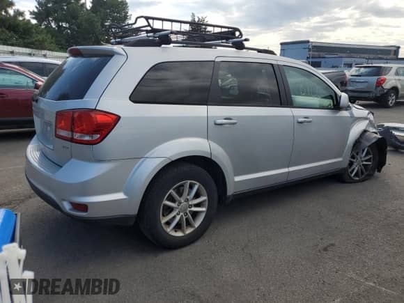2014 Dodge Journey SXT with VIN 3C4PDDBG4ET190769, listed as a Copart auction lot 80368705 with 140,649 mi miles and Salvage title. Bid and sale history available at DreamBid. Image 3.