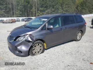 2012 Toyota Sienna XLE AAS with VIN 5TDYK3DC0CS212661, listed as a Copart auction lot 81634935 with 161,468 mi miles and Salvage title. Bid and sale history available at DreamBid. Image 1.