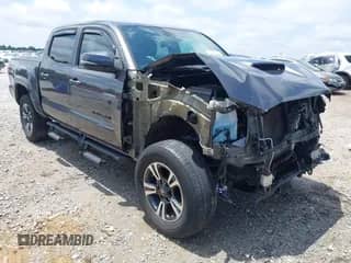 2019 Toyota Tacoma SR z VIN 5TFCZ5AN9KX209158, wystawiony jako IAAI lot #42697267 z przebiegiem 70 160 mil mil oraz . Historia ofert i sprzedaży dostępna na DreamBid. Obrazek 1.