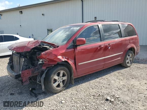 2010 Dodge Grand Caravan SXT with VIN 2D4RN5DX5AR125907, listed as a Copart auction lot 69637335 with 211,789 mi miles and Salvage title. Bid and sale history available at DreamBid. Image 1.