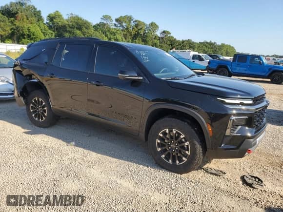 2024 Chevrolet Traverse AWD Z71 with VIN 1GNEVJKS0RJ184673, listed as a Copart auction lot 68578564 with 1,256 mi miles and Salvage title. Bid and sale history available at DreamBid. Image 4.