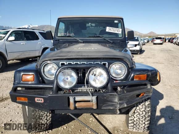 1999 Jeep Wrangler Sahara with VIN 1J4FY49S9XP479545, listed as a Copart auction lot 54753745 with 34,642 mi miles and Salvage title. Bid and sale history available at DreamBid. Image 5.