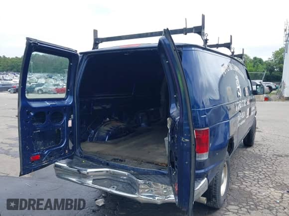 2011 Ford Econoline Cargo Commercial with VIN 1FTNE2EW0BDA30532, listed as a IAAI auction lot 42638196 with 98,596 mi miles and . Bid and sale history available at DreamBid. Image 4.