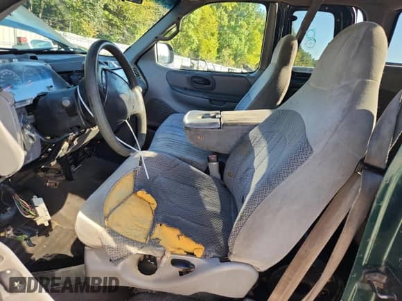 1999 Ford F-150 XL z VIN 1FTRX17L1XNA63324, wystawiony jako Copart lot #87388335 z przebiegiem Nie podano mil oraz Szkoda całkowita • Salvage title. Historia ofert i sprzedaży dostępna na DreamBid. Obrazek 7.