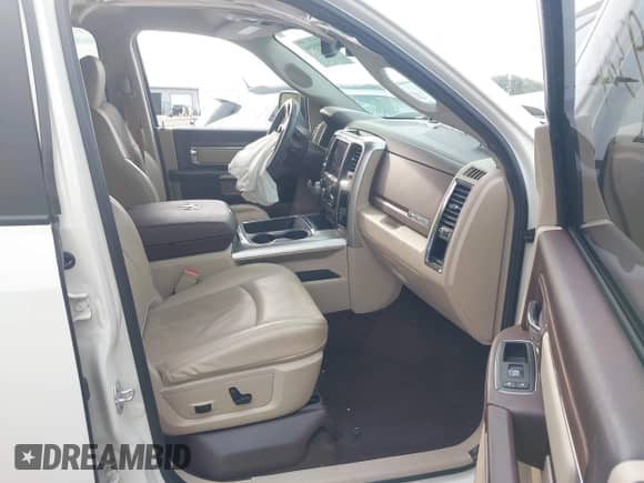 2018 Ram 1500 Laramie with VIN 1C6RR7NT1JS159292, listed as a IAAI auction lot 42893290 with 104,339 mi miles and . Bid and sale history available at DreamBid. Image 5.