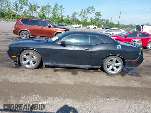 2014 Dodge Challenger R/T с VIN 2C3CDYBT3EH209800, выставлен на аукционе IAAI как лот 42848113 с пробегом 186 882 миль миль и . История ставок и продаж доступна на DreamBid. Изображение 14.